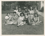 Group of Students Sitting on a Lawn by Brooklyn College