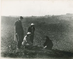 Students examining the soil by Brooklyn College
