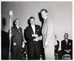 Student being congratulated at a New York Trade School Commencement Ceremony by New York Trade School and Elmo E. Sollitto