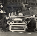 Three students working on a project in the Air Conditioning and Refrigeration Department of the New York Trade School by New York Trade School