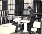 Plumbing Students at Work on a Sink by New York Trade School